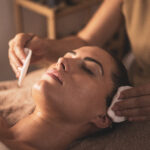 A young woman undergoes facial biotherapy in an aesthetic clinic.Concept of taking care of yourself.